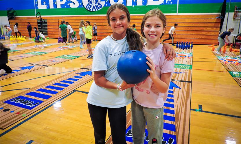 Students bowl in PE class